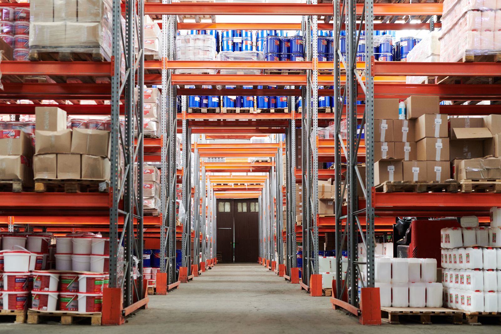 Wholesale warehouse stacked with FMCG stock and pallets